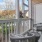 a deck with chairs and a door