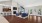 a large living room with blue chairs