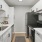 a kitchen with white cabinets