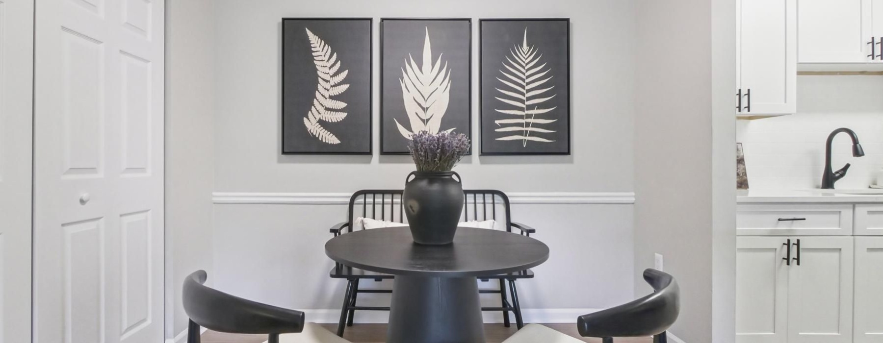 a dining room with a table and chairs