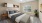 a bedroom with a bed and a fan