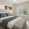 a bedroom with a bed and a fan