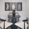 a dining room with a table and chairs