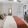 a bedroom with a bed and a fan