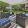 a patio with a couch and chairs