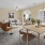 a living room with a table and chairs