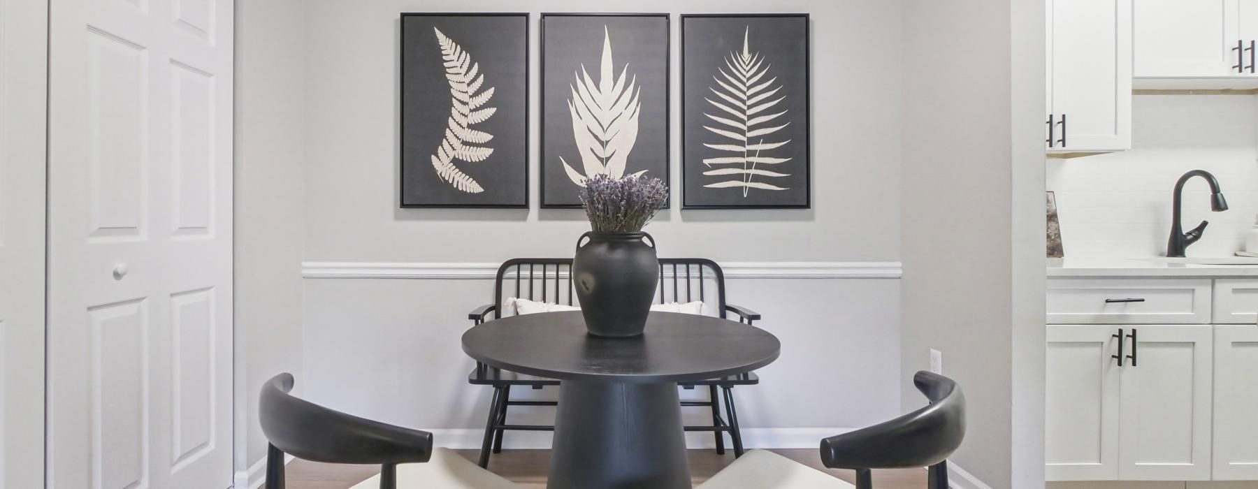 a dining room with a table and chairs