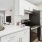 a kitchen with white cabinets