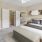a bedroom with a bed and a rug