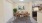 a dining room with a table and chairs