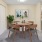 a dining room with a table and chairs