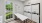 a room with white cabinets and a table